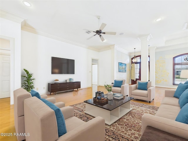 living area featuring recessed lighting, decorative columns, light wood-style floors, and ornamental molding