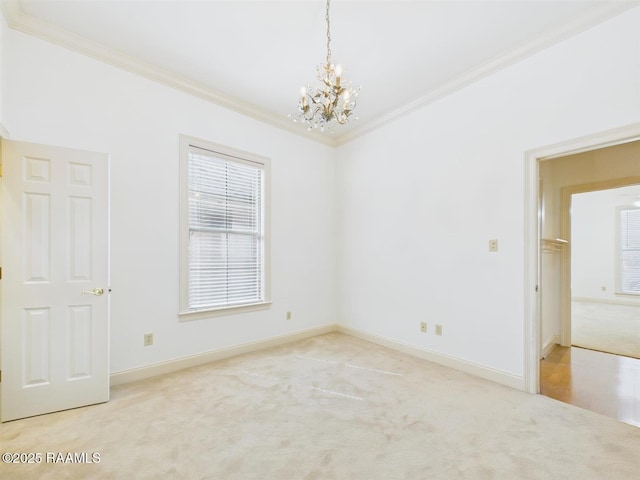 carpeted spare room with baseboards, plenty of natural light, and crown molding