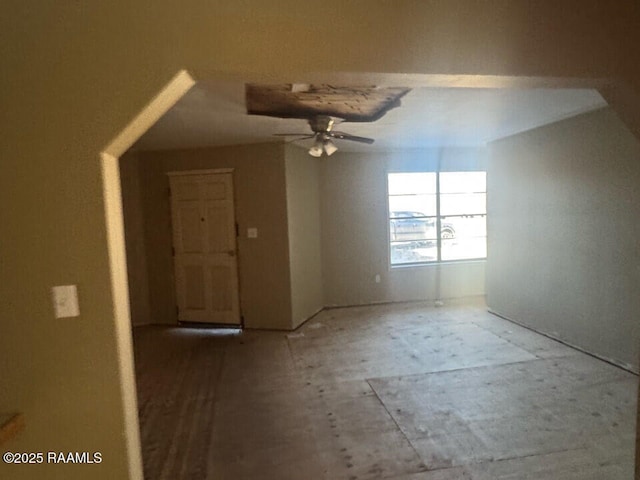 additional living space featuring ceiling fan