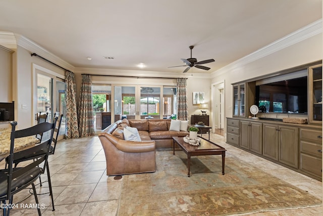 tiled living room with french doors, ceiling fan, and crown molding