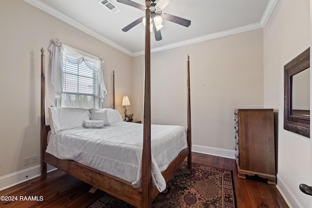 bedroom with crown molding, dark wood-type flooring, and ceiling fan