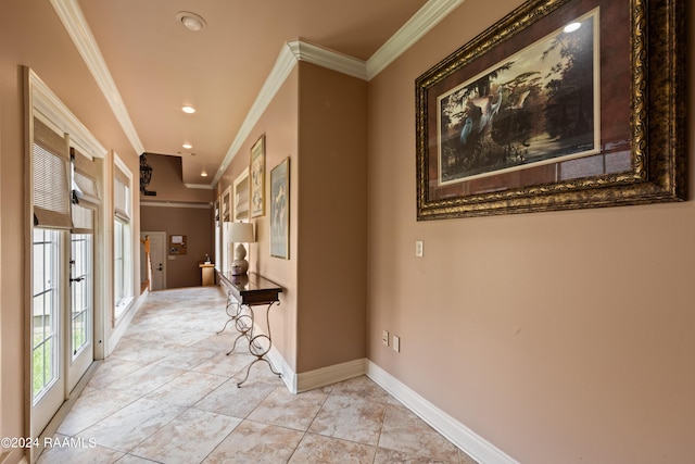 hall with light tile patterned flooring and ornamental molding