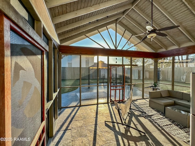 unfurnished sunroom featuring ceiling fan, wooden ceiling, and vaulted ceiling with beams