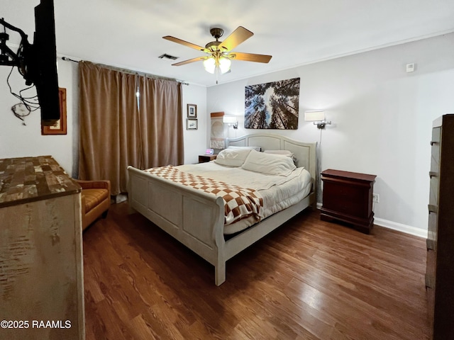 bedroom with dark wood-type flooring and ceiling fan