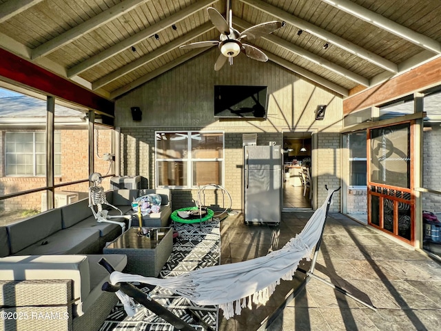 view of patio / terrace with ceiling fan and an outdoor living space