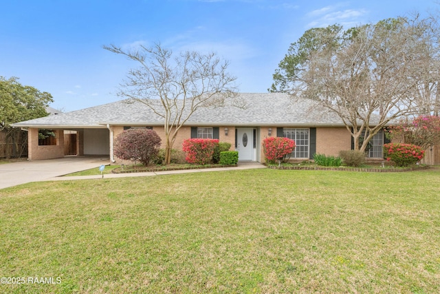 single story home featuring fence, a carport, concrete driveway, a front lawn, and brick siding