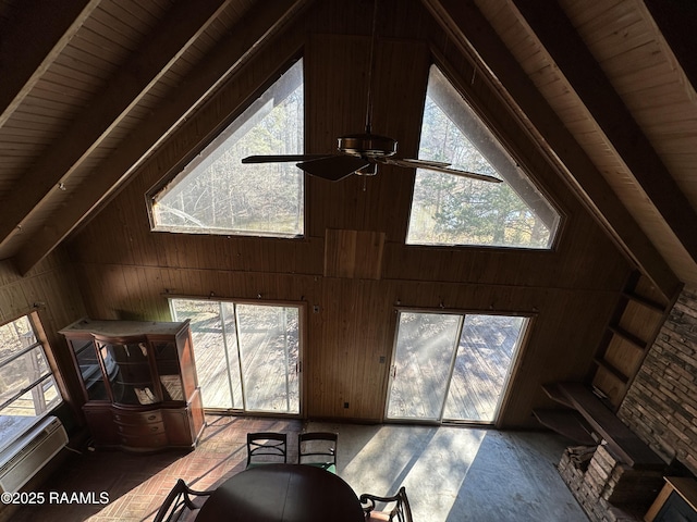 interior details with ceiling fan, wooden walls, beam ceiling, and wooden ceiling