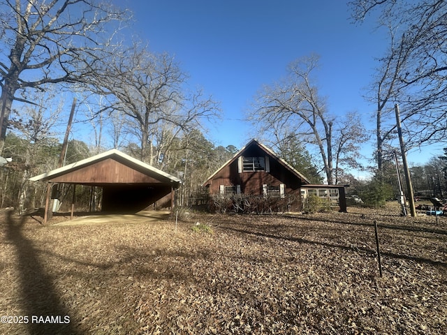 view of side of property featuring a carport