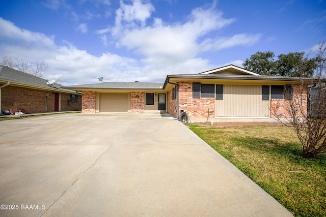 ranch-style home with a garage and a front yard