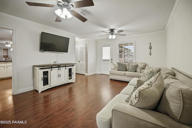 living room featuring crown molding, ceiling fan, and dark wood-type flooring