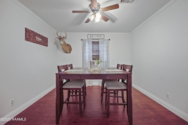 dining area with ceiling fan, ornamental molding, and dark hardwood / wood-style floors