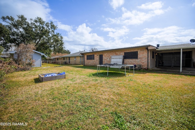 view of yard with a trampoline