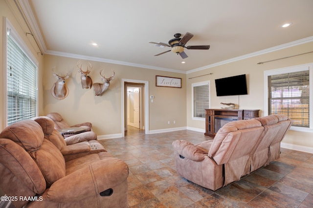 living room featuring ornamental molding and ceiling fan