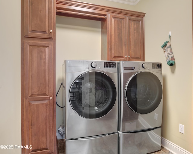 laundry area with cabinets and washer and dryer