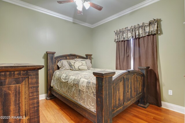 bedroom with ceiling fan, ornamental molding, and light wood-type flooring