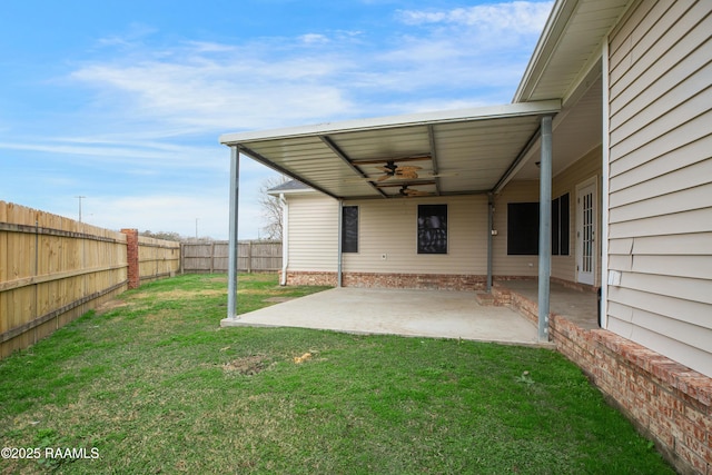 view of yard with a patio area and ceiling fan