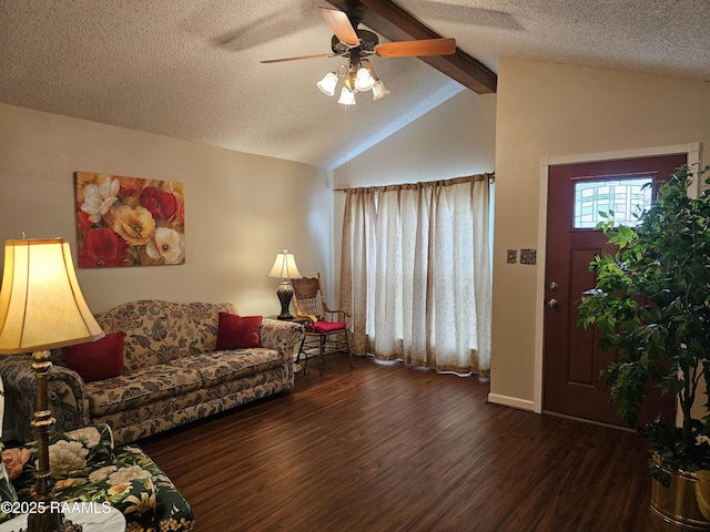 living room with vaulted ceiling with beams, ceiling fan, a textured ceiling, and wood finished floors