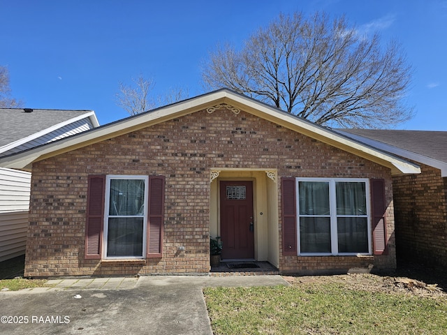 view of front of home featuring brick siding