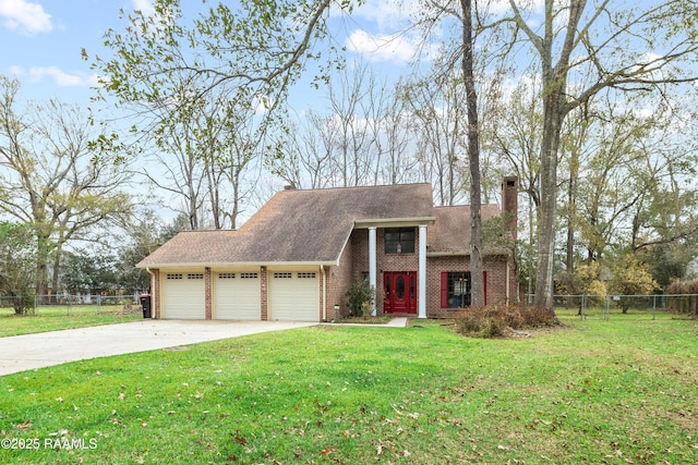 view of front of property featuring a garage and a front lawn