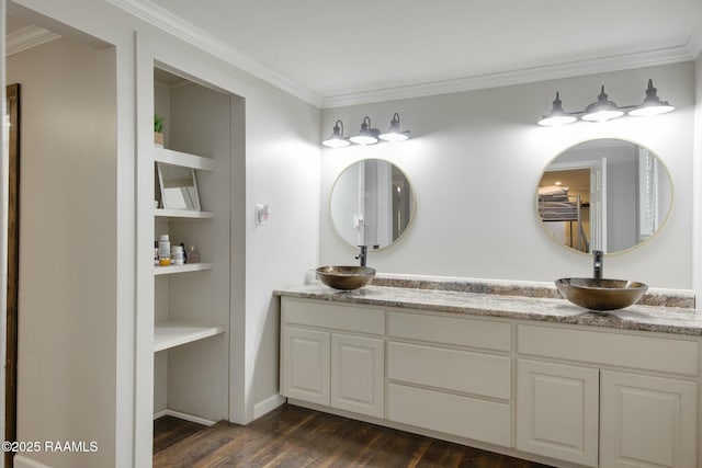 bathroom featuring vanity, hardwood / wood-style floors, built in features, and crown molding