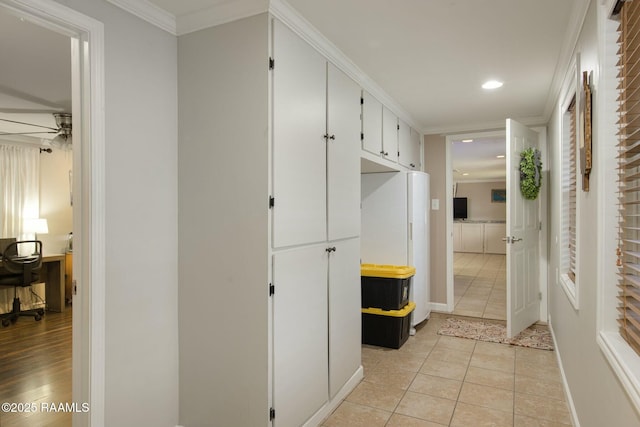 mudroom with crown molding, light tile patterned floors, and ceiling fan