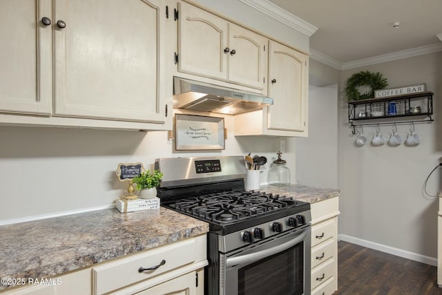 kitchen with crown molding, dark hardwood / wood-style floors, cream cabinetry, and stainless steel gas stove