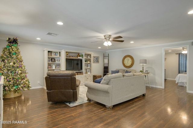 living room with ceiling fan, ornamental molding, and dark hardwood / wood-style flooring