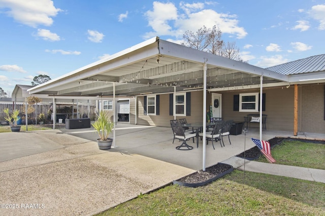 rear view of property featuring a patio area