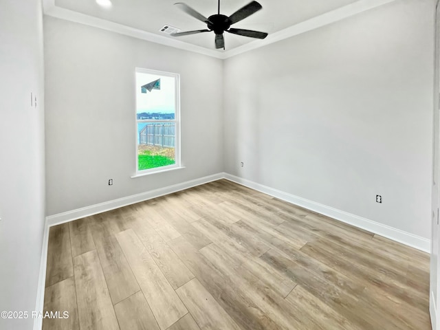 empty room with crown molding, ceiling fan, and light hardwood / wood-style flooring