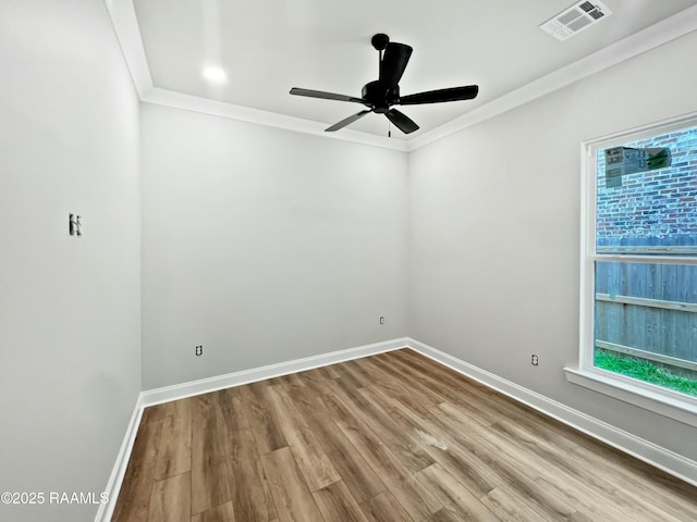 unfurnished room featuring crown molding, ceiling fan, and light wood-type flooring