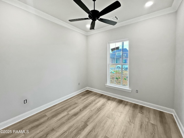 unfurnished room featuring crown molding, ceiling fan, and light hardwood / wood-style floors