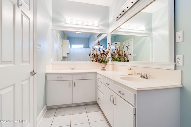 bathroom featuring tile patterned flooring and vanity