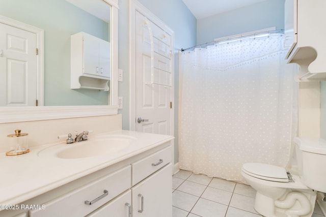 bathroom with a shower with curtain, vanity, toilet, and tile patterned flooring