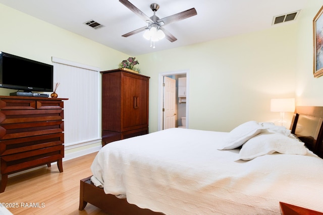 bedroom with light hardwood / wood-style flooring and ceiling fan