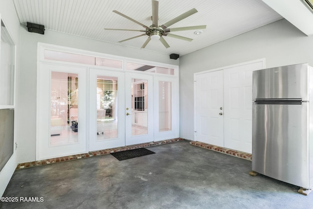 interior space with french doors and ceiling fan