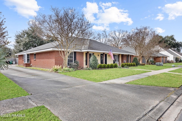 ranch-style home with a front lawn