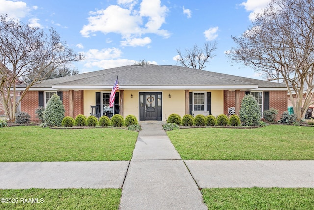 ranch-style home featuring a front yard and covered porch