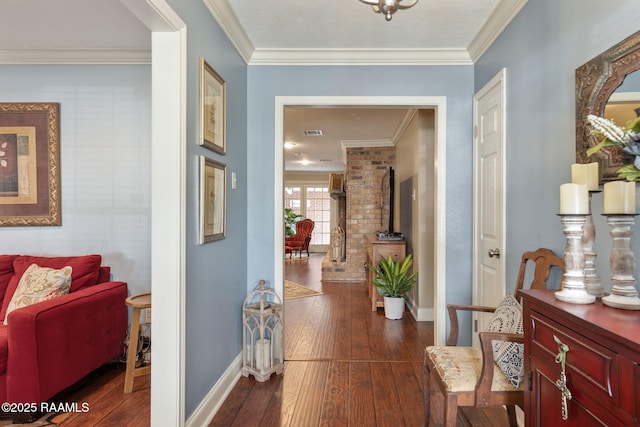 hallway featuring crown molding and dark hardwood / wood-style floors