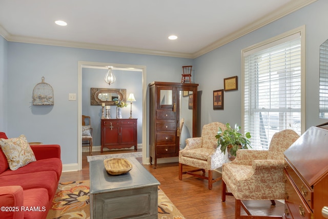 living room with ornamental molding and light wood-type flooring