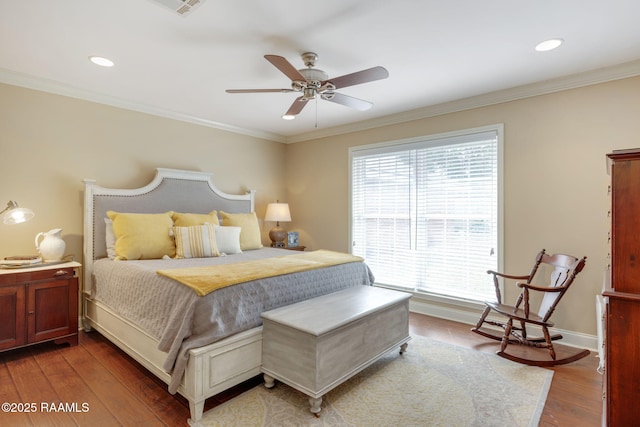 bedroom with hardwood / wood-style flooring, ceiling fan, and crown molding