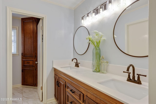 bathroom with ornamental molding and vanity