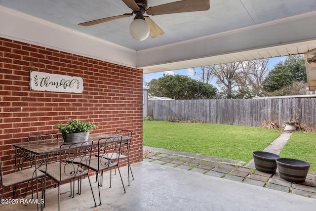 view of patio featuring ceiling fan