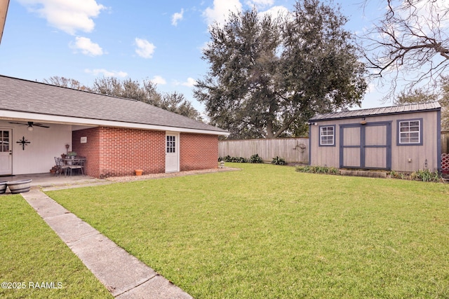 view of yard featuring a patio and a storage unit