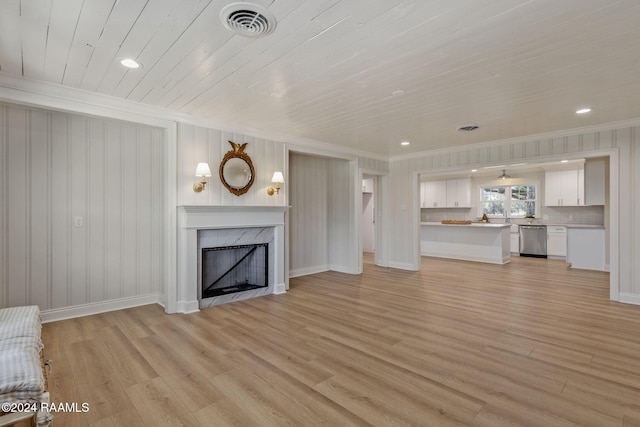 unfurnished living room with ornamental molding, a premium fireplace, light hardwood / wood-style flooring, and wooden ceiling