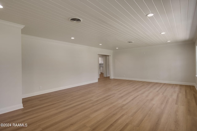 spare room with crown molding, light hardwood / wood-style flooring, and wooden ceiling