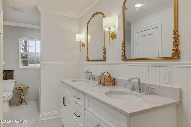 bathroom with vanity, tile patterned flooring, ornamental molding, and toilet