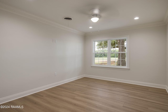 unfurnished room featuring hardwood / wood-style floors, ornamental molding, and ceiling fan