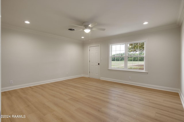 spare room featuring crown molding, ceiling fan, and light hardwood / wood-style floors