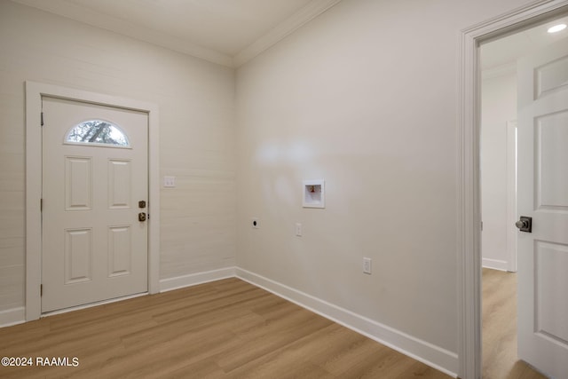 laundry area with ornamental molding, electric dryer hookup, washer hookup, and light wood-type flooring