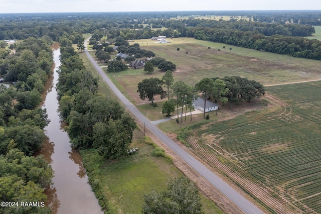 drone / aerial view featuring a water view and a rural view